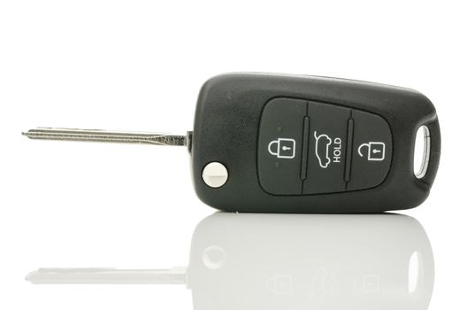 Black car key isolated on a white background.