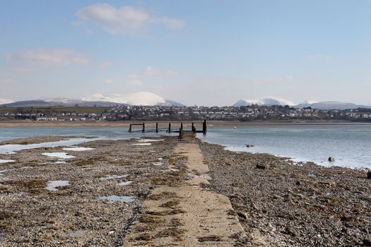 Medievil Caernarfon castle and town with Snowdonia as a back drop in north Wales 