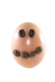 Smiling easter egg decorated with coffee