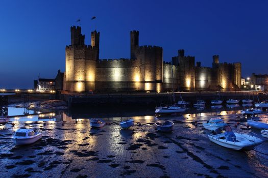 Medievil Caernarfon castle at twilight in north Wales 