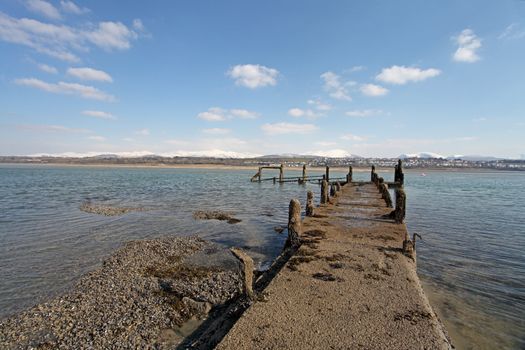 Medievil Caernarfon castle and town with Snowdonia as a back drop in north Wales 