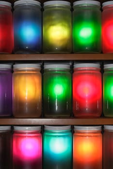 Selection of jars with multicolored light shining through them