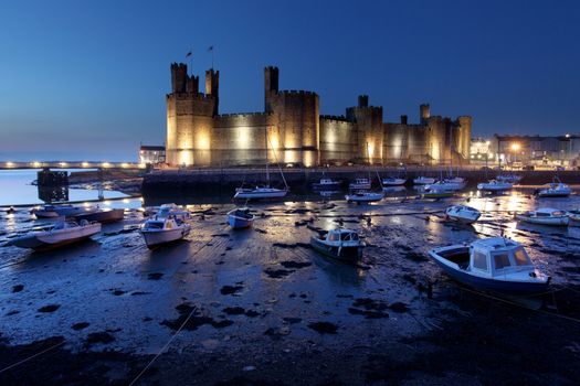 Medievil Caernarfon castle at twilight in north Wales 