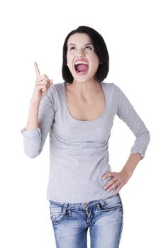 Surprised woman screaming and pointing at copy space. Isolated on white background.