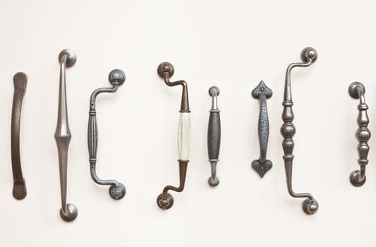 A selection of antique wrought iron door handles