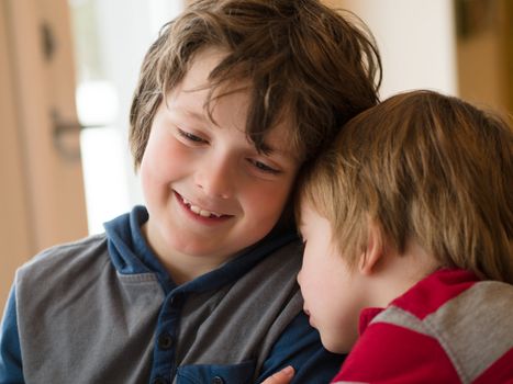 Two loving brothers hugging each other