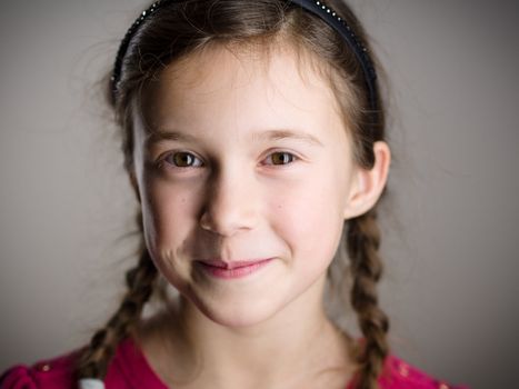 Cute little girl smiling in studio