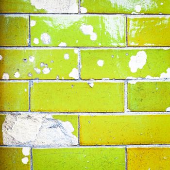 A vibrant wall showing damage to the brickwork