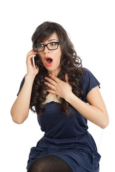 Woman in glasses emotionally speaks on a mobile phone