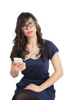 Woman in glasses emotionally speaks on a mobile phone