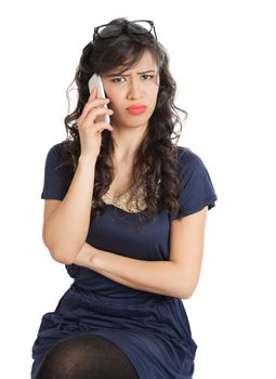 Woman in glasses emotionally speaks on a mobile phone