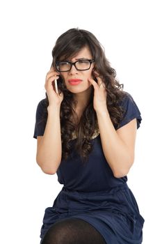 Woman in glasses emotionally speaks on a mobile phone