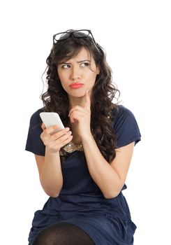 Woman in glasses emotionally speaks on a mobile phone