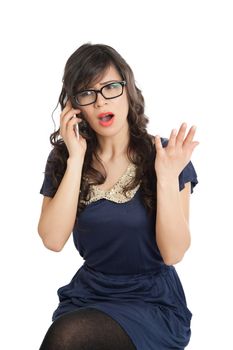 Woman in glasses emotionally speaks on a mobile phone