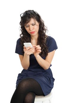 Woman in glasses emotionally speaks on a mobile phone