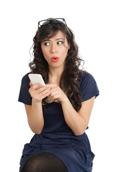 Woman in glasses emotionally speaks on a mobile phone