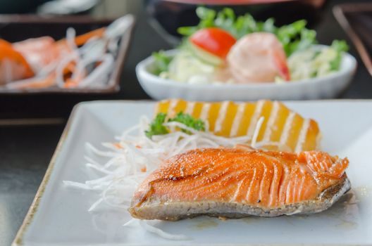 grilled salmon and fresh vegetable on dish