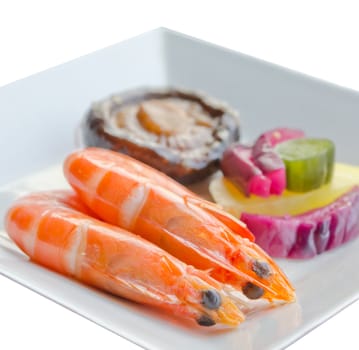 boiled shrimps with pickled vegetable and mushroom on white  plate, white background