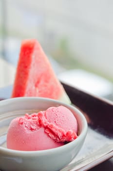 strawberry ice cream in  bowl and  fresh watermelon