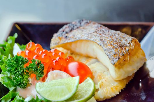  fresh salad with fish egg  and Japanese grilled cod fish  on dish