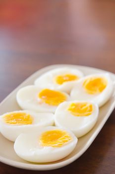 slice of boiled eggs on pink dish