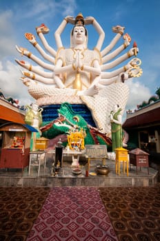 Eighteen arms Buddha over blue sky, Koh Samui. Thailand