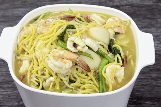 Hokkien Mee Stir Fry Yellow Noodles with Prawns Squids Fishcake and Green Vegetables