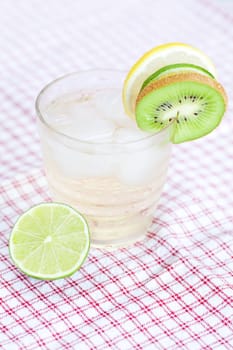 water with lemon and lime,kiwi in a glass with ice