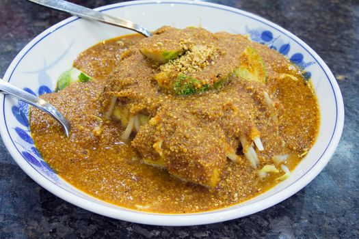 Malay Tauhu Goreng Fried Tofu Dish with Cucumbers Bean Sprouts Covered with Peanut Gravy Sauce Closeup
