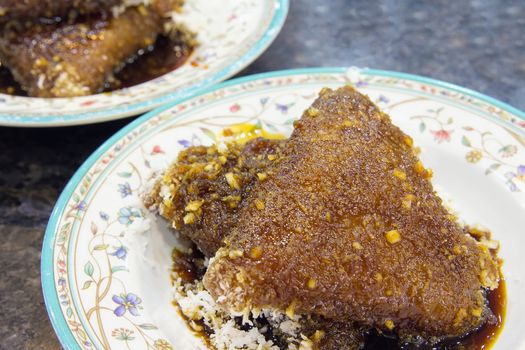 Malay Kueh Lopes Glutinous Rice with Gula Melaka Sugar Syrup and Grated Coconut Dessert Closeup