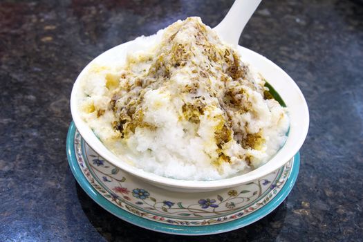 Cendol Shaved Ice Dessert with Gula Melaka Sugar Syrup and Coconut Milk Closeup