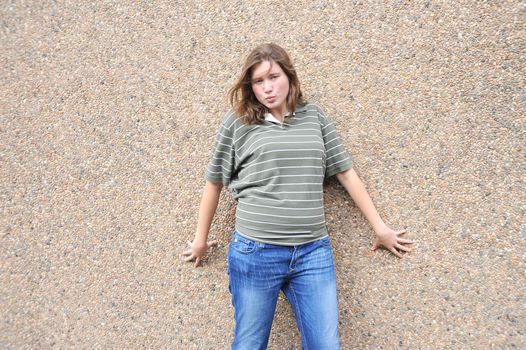 Female tomboy posing outside.