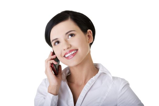 Attractive businesswoman with mobile phone. Isolated on white background