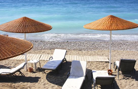 Beach chairs and umbrellas on a beach