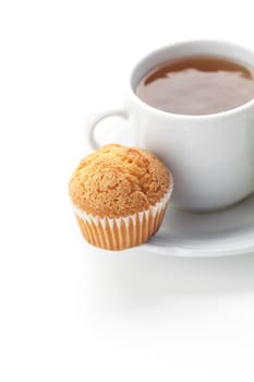 cup of tea and muffin isolated on white