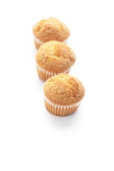 three muffins isolated on white