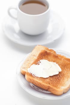 tea and toast with butter isolated on white