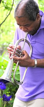 African American man with his flugelhorn.