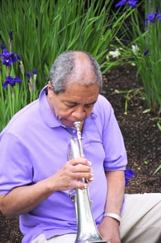 African American man with his flugelhorn.