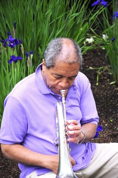 African American man with his flugelhorn.