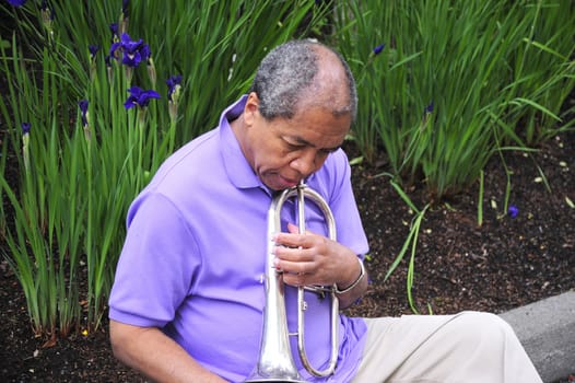 African American man with his flugelhorn.