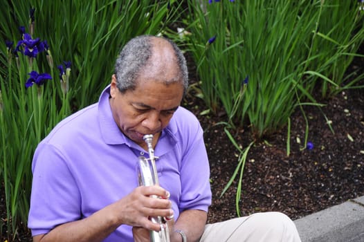 African American man with his flugelhorn.