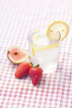 cocktail with ice,lemon, fig and strawberries 