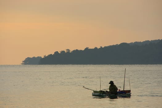 Silhouette of fisherman at sunrise, Gulf of Thailand, Cambodia, Southeast Asia