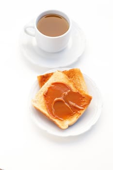 tea and toast with caramel isolated on white