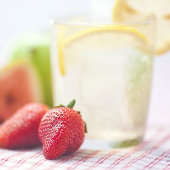 cocktail with ice,lemon, fig,apple and strawberries 