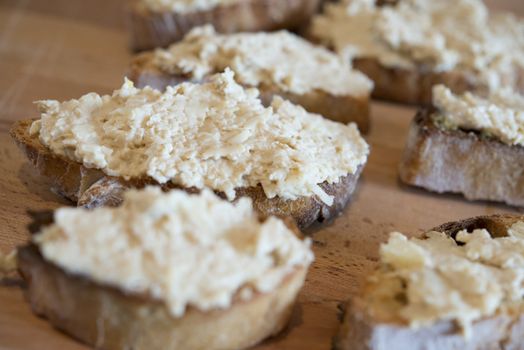 Some bread slices with some camembert chhese