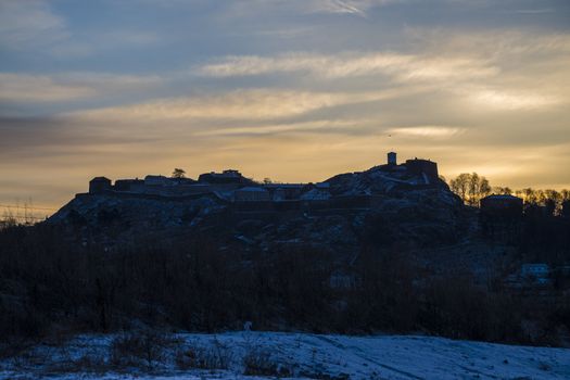 The photo was shot at 6:00 in the morning one day in March and shows Fredriksten Fortress in Halden, Norway covered with snow and the fortress appears as a silhouette against the rising sun.