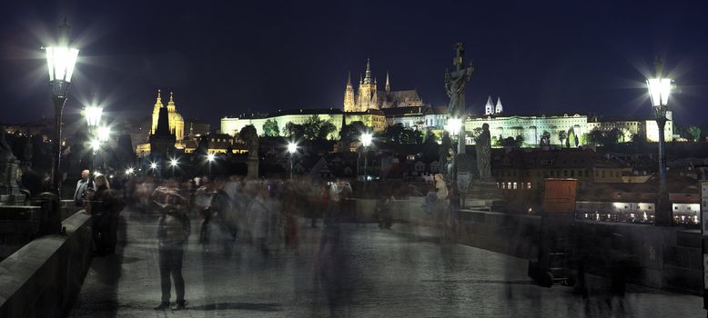panoramic view of famous bridge in Prague by night