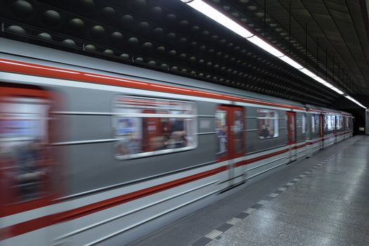 Train arrives on station at Prague subway. 